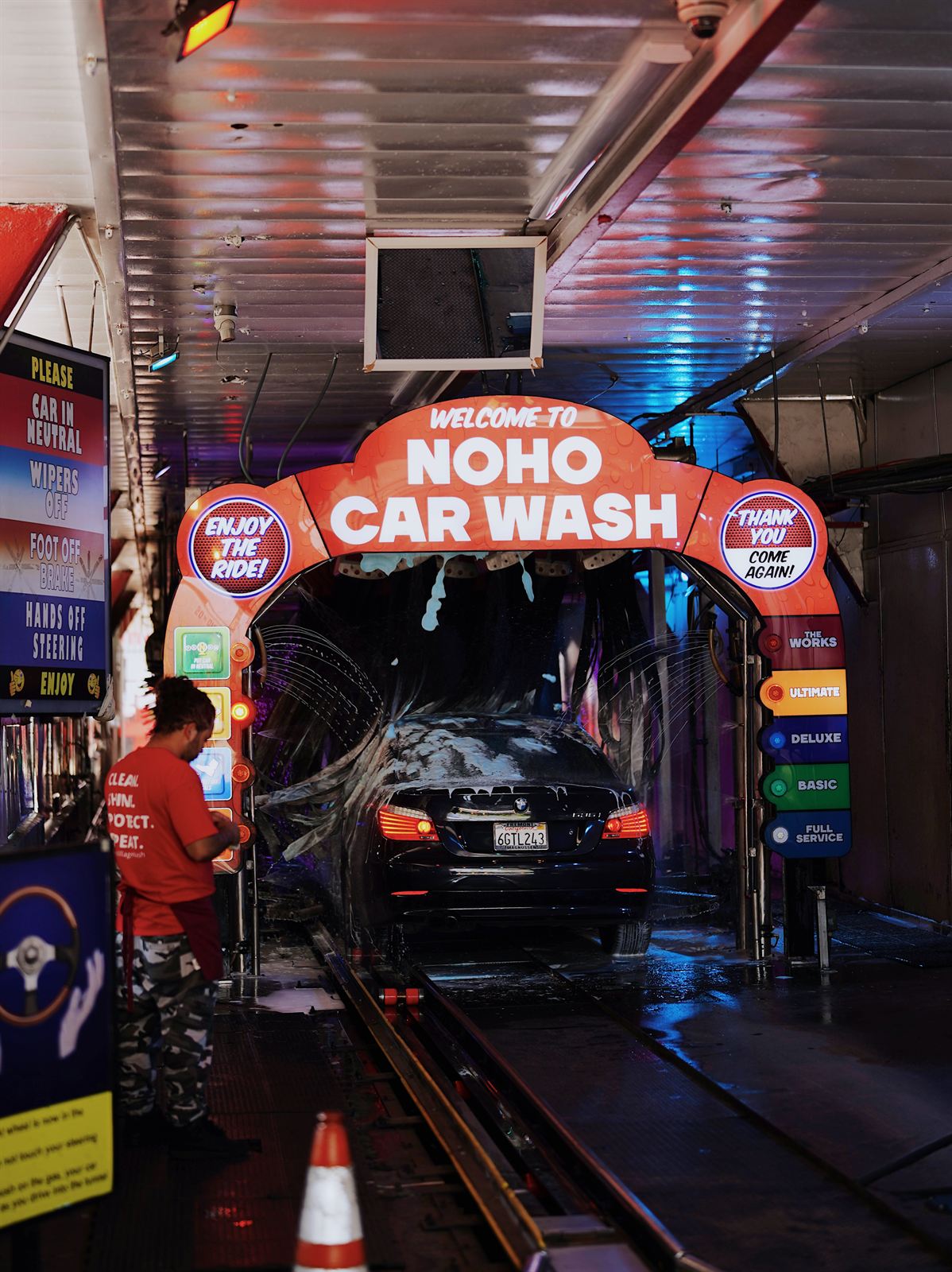 Car entering the LED-lit express tunnel at Laurel Canyon Car Wash